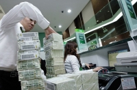 Chao đảo vì tác động của tỷ giá